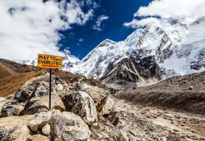 Way to Mount Everest Base Camp signpost in Himalayas, Nepal. Khumbu glacier and valley snow on mountain peaks, beautiful view landscape