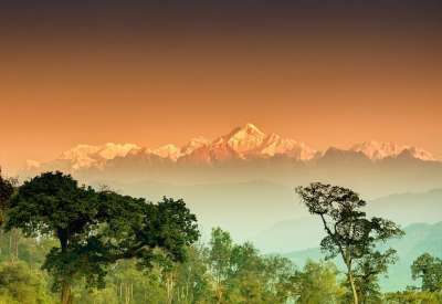 Mt. Kanchenjunga looking painted in orange color during the time of sunrise